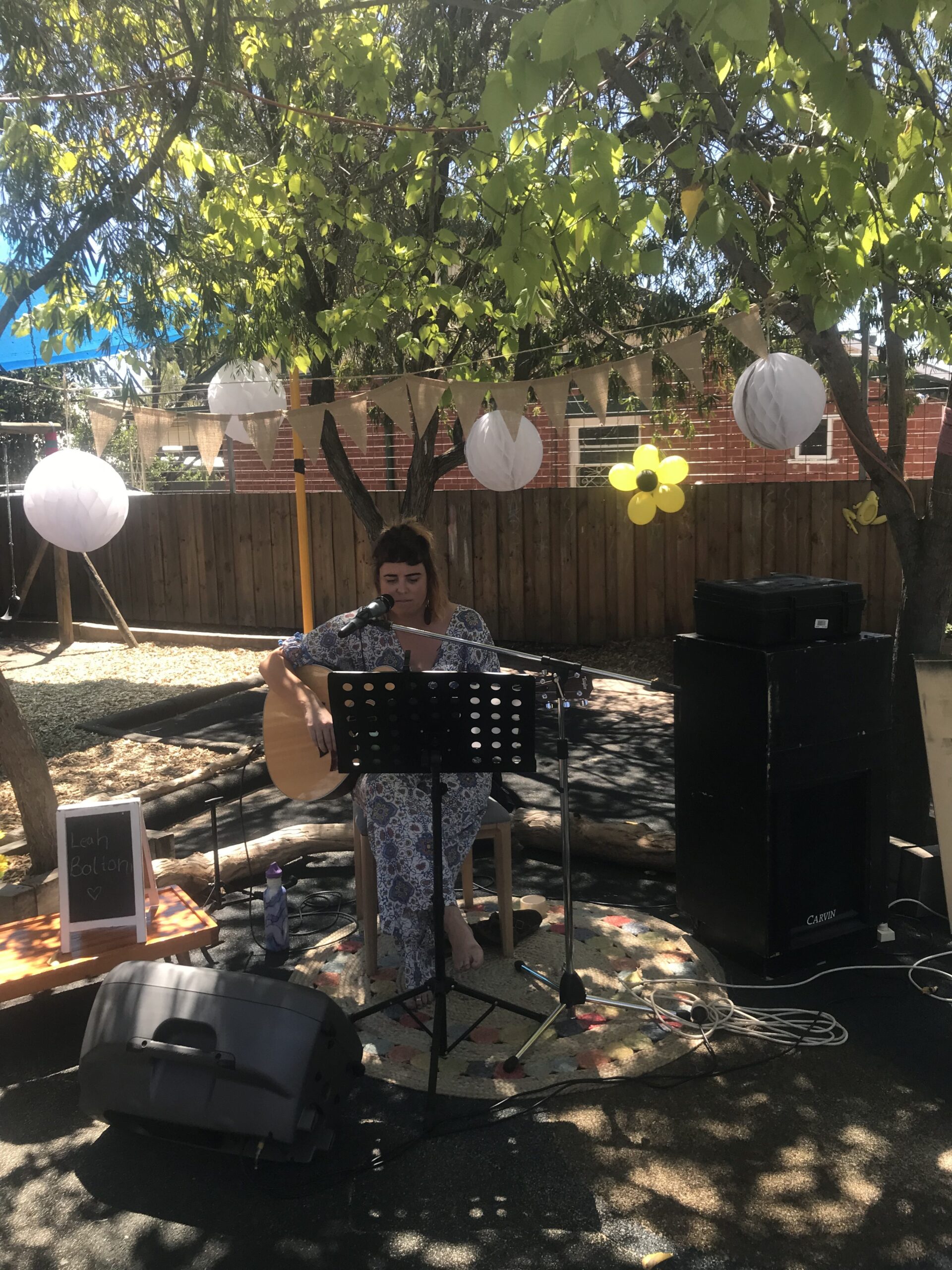 Musician Leah Bolton performing at 30th anniversary of the childcare centre